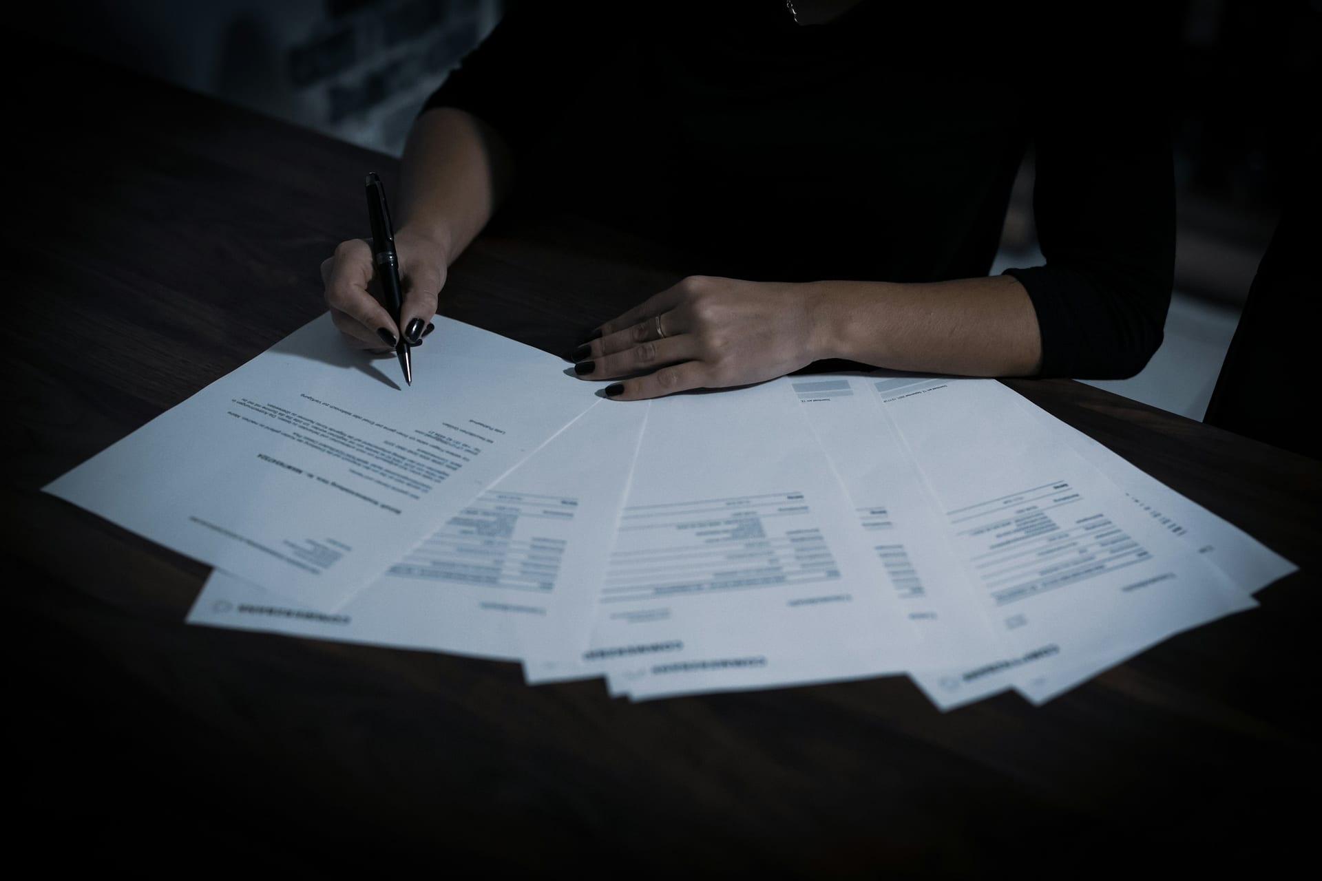 Employment and payroll documents laid out for review